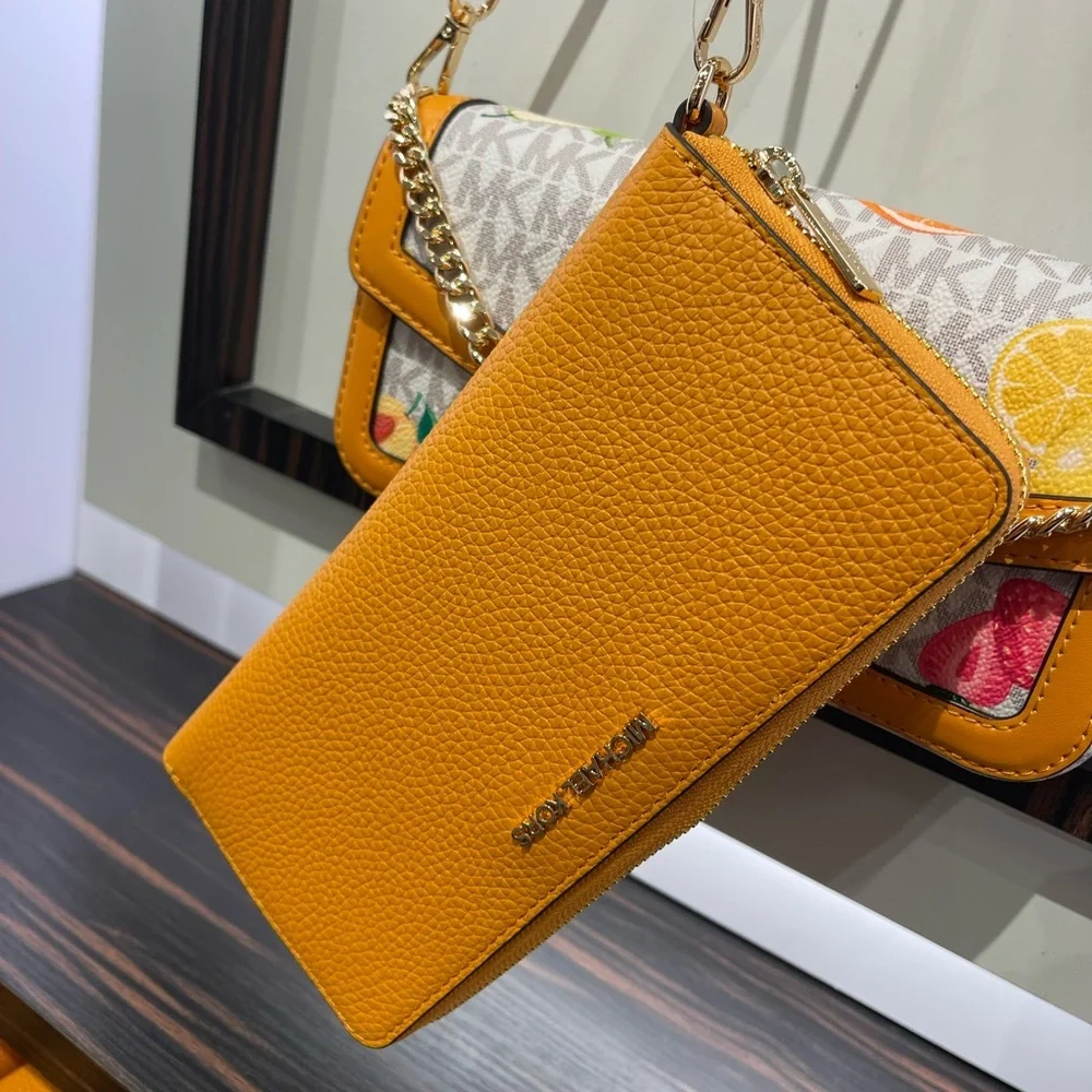 MICHAEL KORS Jet Set Travel Lg Pebbled Leather Continental Wristlet
Rad Orange - Picture 15 of 16
